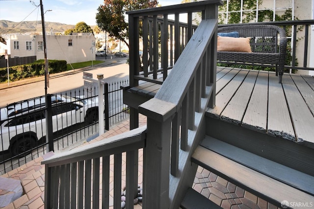 wooden terrace featuring a mountain view