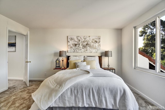 carpeted bedroom with baseboards