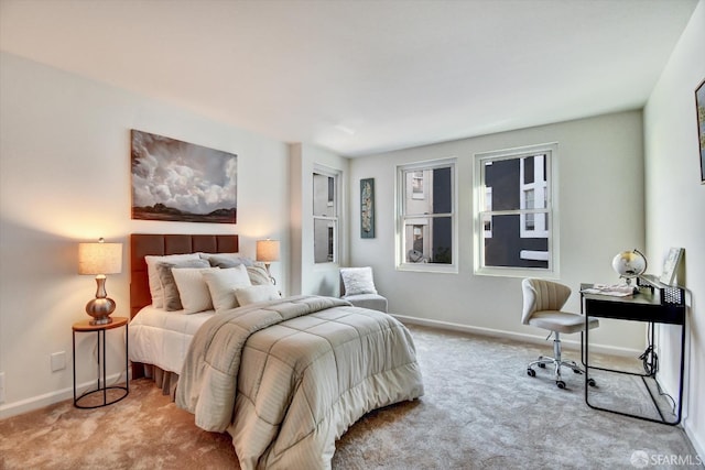 bedroom featuring baseboards and carpet floors