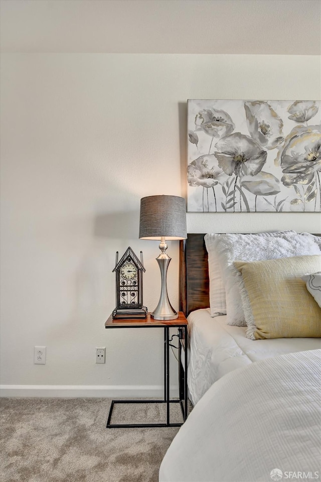 bedroom featuring carpet flooring and baseboards