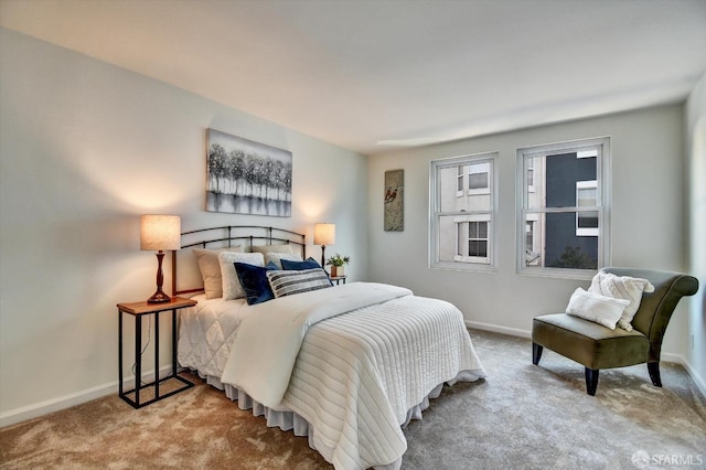 bedroom featuring baseboards and carpet floors