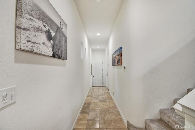 hallway featuring recessed lighting, stairs, and baseboards