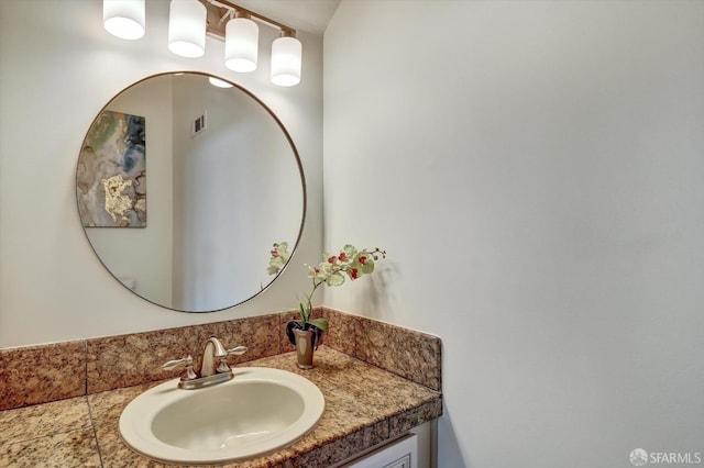 bathroom with vanity and visible vents