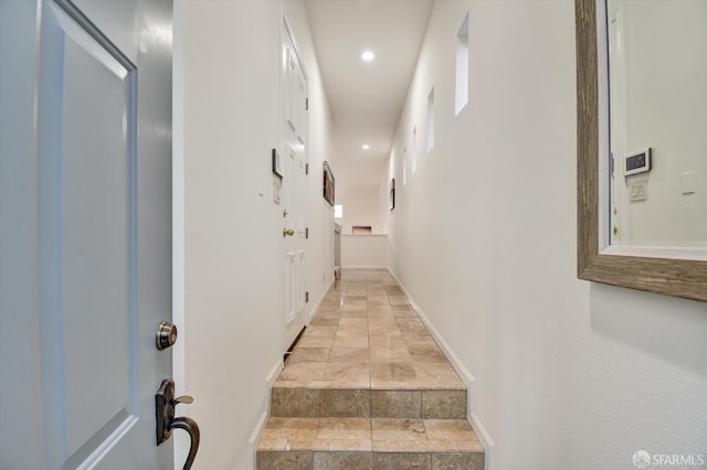 interior space with recessed lighting and baseboards