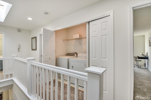 hallway featuring an upstairs landing, independent washer and dryer, recessed lighting, carpet, and a skylight