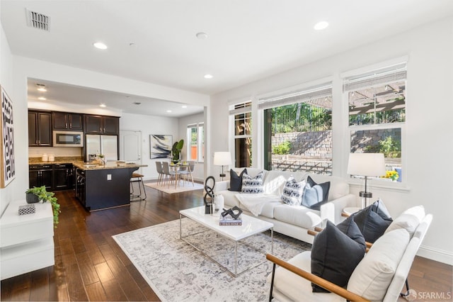 3069 Vittoria Loop, Dublin, CA 94568 - living room with dark wood finished floors and recessed lighting