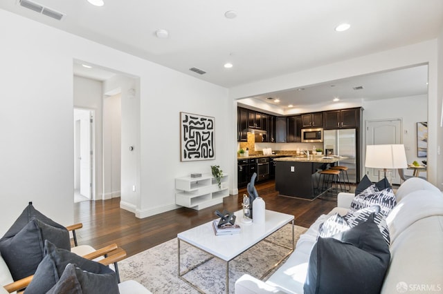 3069 Vittoria Loop, Dublin, CA 94568 - living room with dark wood-style floors and recessed lighting