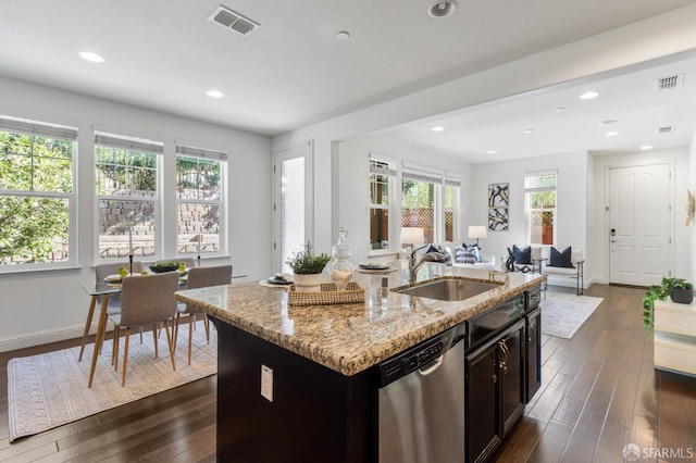 3069 Vittoria Loop, Dublin, CA 94568 - kitchen with stainless steel dishwasher, open floor plan, dark wood-style floors, a center island with sink, and recessed lighting