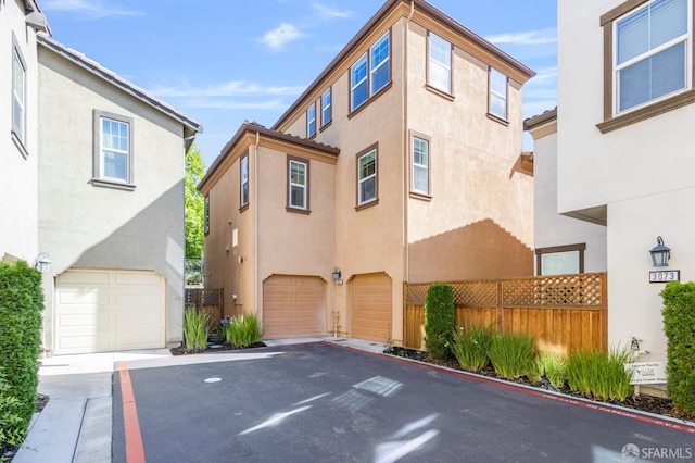3069 Vittoria Loop, Dublin, CA 94568 - view of front facade with stucco siding, a garage, and asphalt driveway