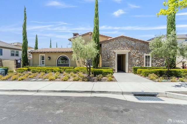 3069 Vittoria Loop, Dublin, CA 94568 - view of front of home featuring stucco siding, a tile roof, and stone siding