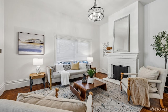 432 Buchanan St, San Francisco, CA 94102 - living room with a chandelier, baseboards, a brick fireplace, and wood finished floors