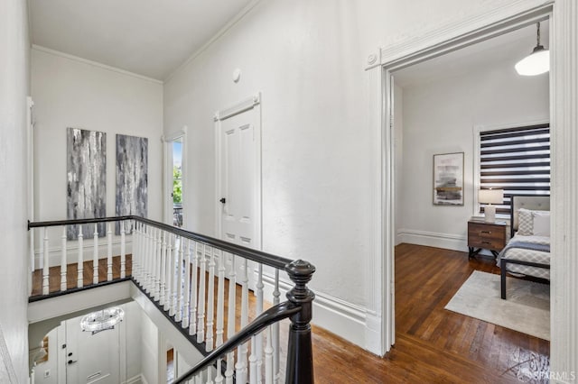 432 Buchanan St, San Francisco, CA 94102 - hallway with an upstairs landing, wood finished floors, crown molding, and baseboards