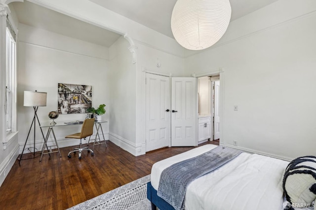 432 Buchanan St, San Francisco, CA 94102 - bedroom with ornate columns, wood finished floors, an office area, baseboards, and a closet