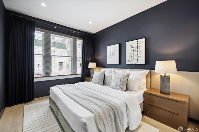 bedroom featuring light hardwood / wood-style flooring