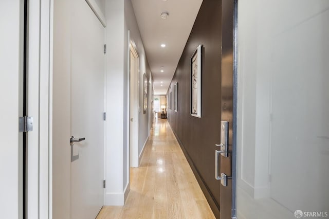 corridor featuring light hardwood / wood-style floors