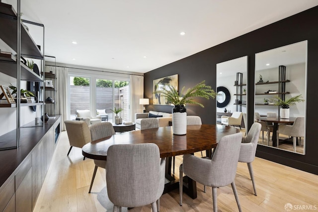 dining area with light hardwood / wood-style flooring