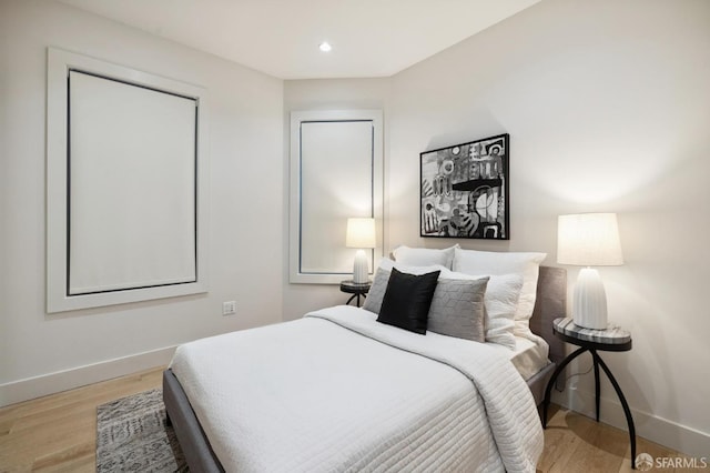 bedroom with light hardwood / wood-style flooring