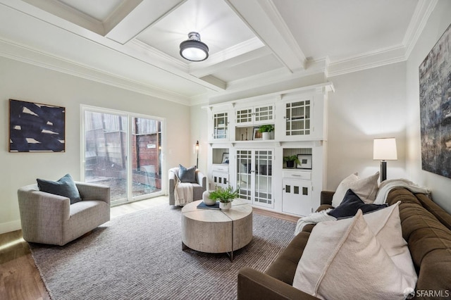 living room featuring coffered ceiling, crown molding, wood-type flooring, and beamed ceiling