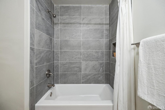 bathroom with shower / bathtub combination with curtain