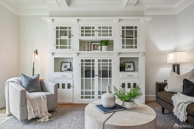 living room featuring hardwood / wood-style floors and crown molding