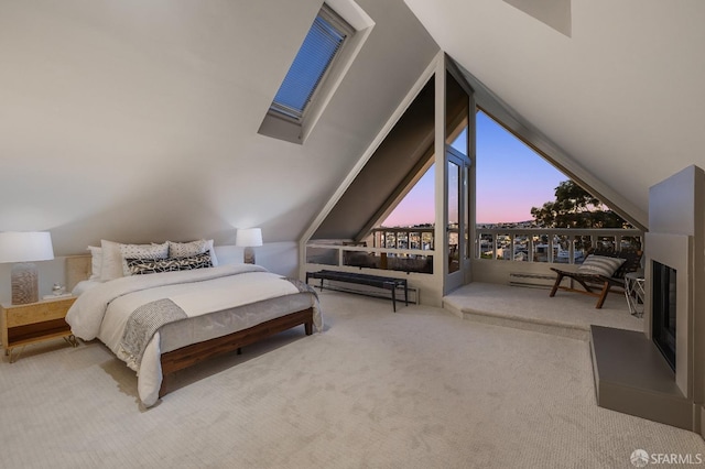 bedroom featuring a baseboard radiator, lofted ceiling, and carpet