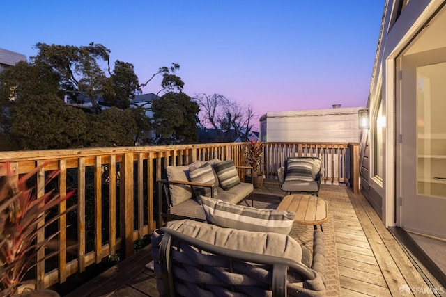 wooden deck with an outdoor hangout area