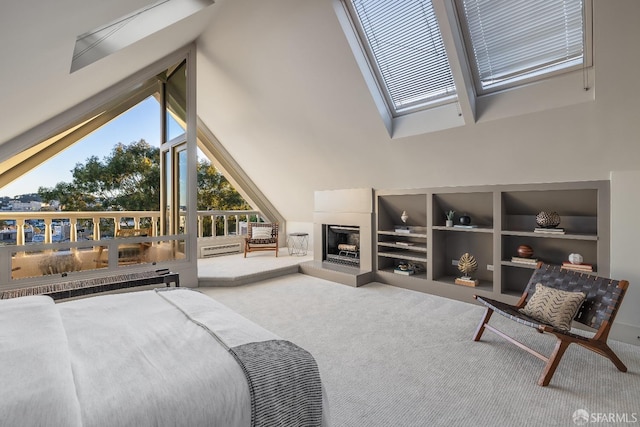 bedroom featuring carpet floors, radiator, high vaulted ceiling, and a fireplace with raised hearth