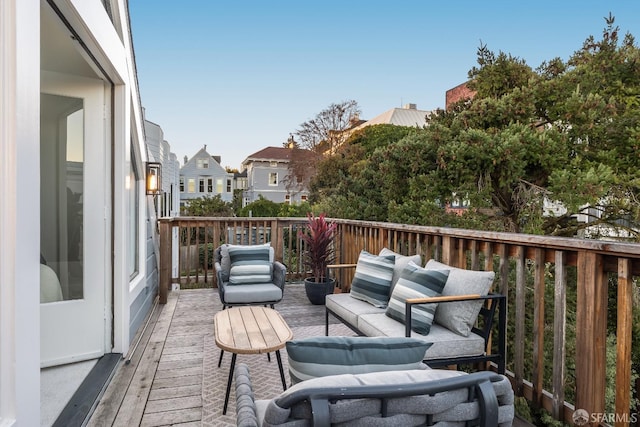 deck with a residential view and outdoor lounge area