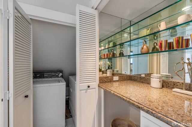 laundry room with laundry area and washer / clothes dryer