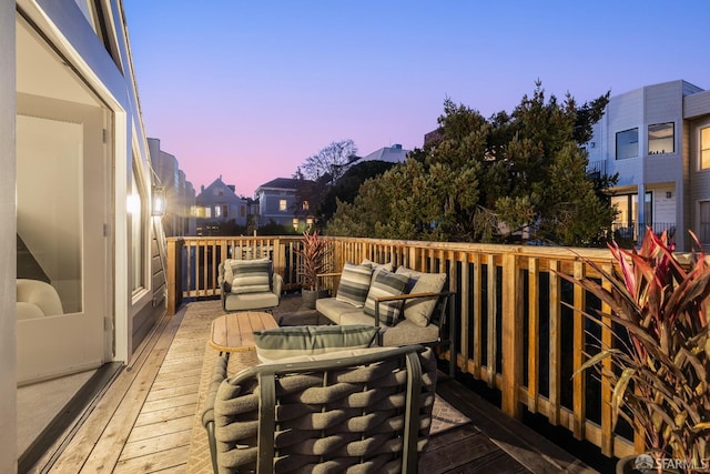 wooden deck featuring outdoor dining area