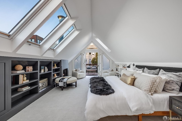 carpeted bedroom with lofted ceiling with skylight