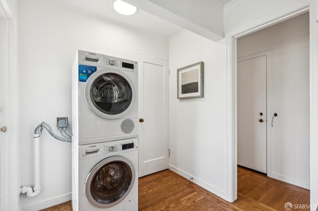 221 Lily St, San Francisco, CA 94102 - clothes washing area with stacked washer and clothes dryer, wood finished floors, and baseboards