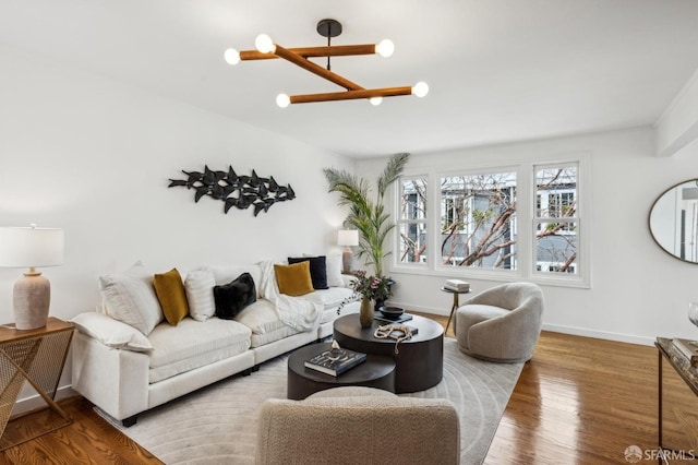 221 Lily St, San Francisco, CA 94102 - living room with wood finished floors, baseboards, and a chandelier