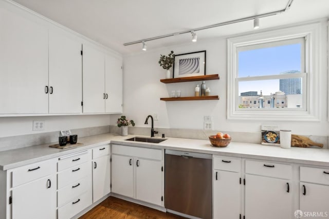 221 Lily St, San Francisco, CA 94102 - kitchen featuring a sink, stainless steel dishwasher, track lighting, white cabinets, and light countertops