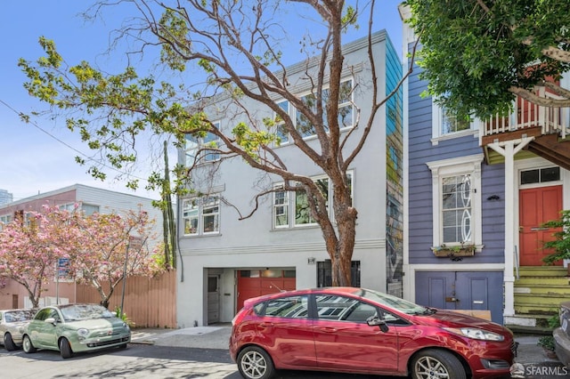 221 Lily St, San Francisco, CA 94102 - townhome / multi-family property with an attached garage and stucco siding