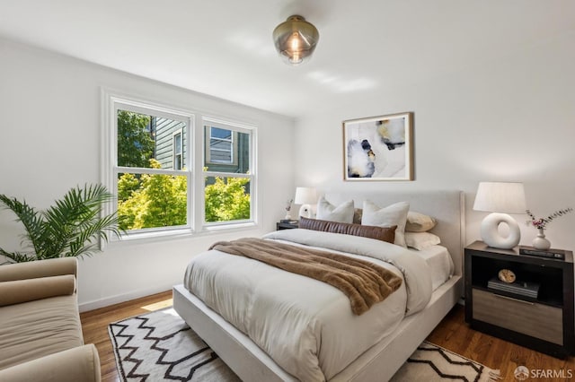 221 Lily St, San Francisco, CA 94102 - bedroom featuring baseboards and wood finished floors