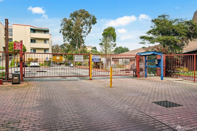 view of gate with fence