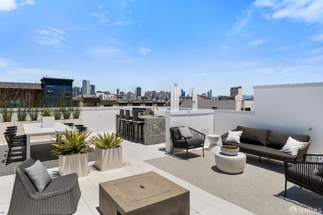 view of patio with an outdoor living space and an outdoor bar