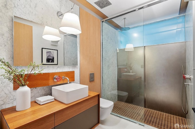 bathroom featuring toilet, concrete floors, walk in shower, and vanity