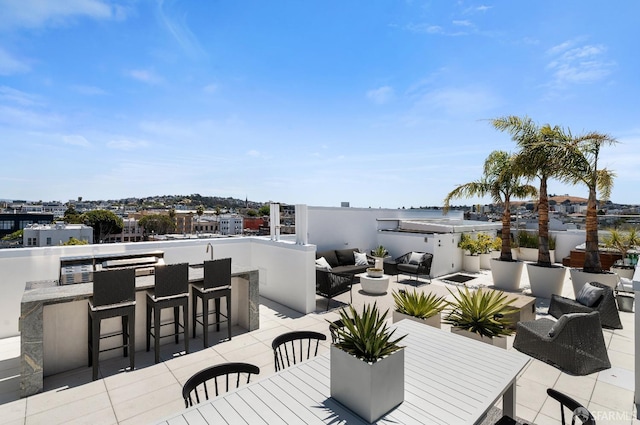 view of patio / terrace with an outdoor living space and exterior bar