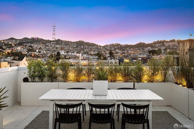 view of patio terrace at dusk