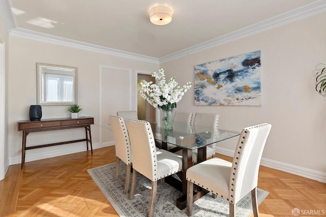 dining room featuring crown molding and parquet flooring