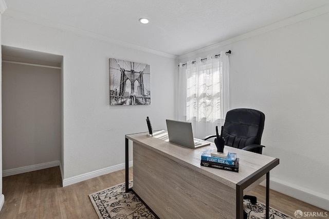 home office with crown molding and wood-type flooring