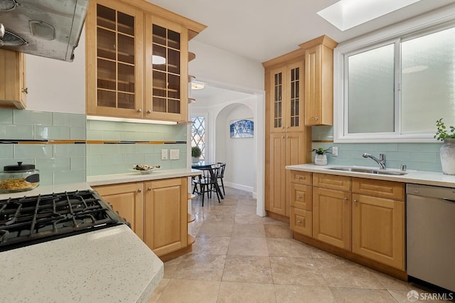 kitchen featuring sink, dishwasher, backsplash, range hood, and light brown cabinets