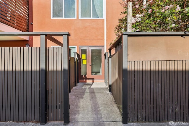 10 Inca Ln Unit 1, San Francisco, CA 94115 - view of home's exterior with fence, a gate, and stucco siding