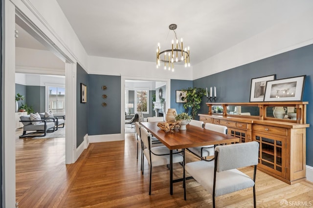 1371-1373 16th Ave, San Francisco, CA 94122 - dining space featuring a chandelier, light wood finished floors, and plenty of natural light