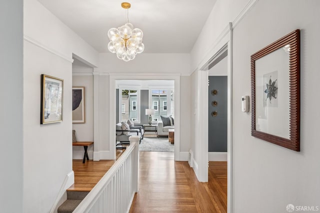 1371-1373 16th Ave, San Francisco, CA 94122 - hall with light wood-style floors and a chandelier