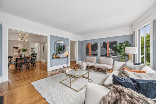 1371-1373 16th Ave, San Francisco, CA 94122 - living area with light wood finished floors and a chandelier