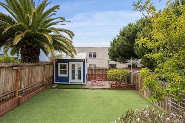 1371-1373 16th Ave, San Francisco, CA 94122 - fenced backyard featuring an outbuilding, a patio area, and french doors