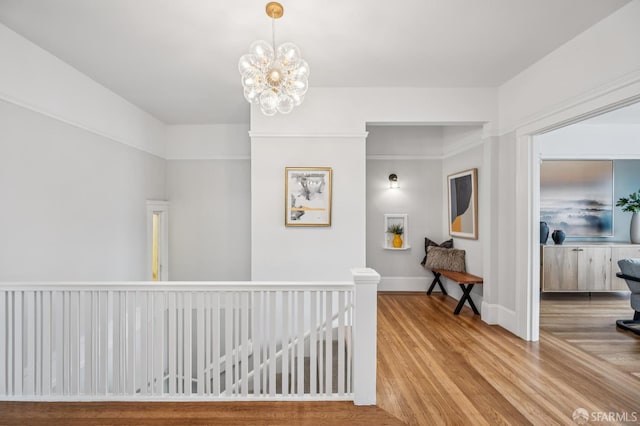 1371-1373 16th Ave, San Francisco, CA 94122 - corridor with wood finished floors, an upstairs landing, and a chandelier